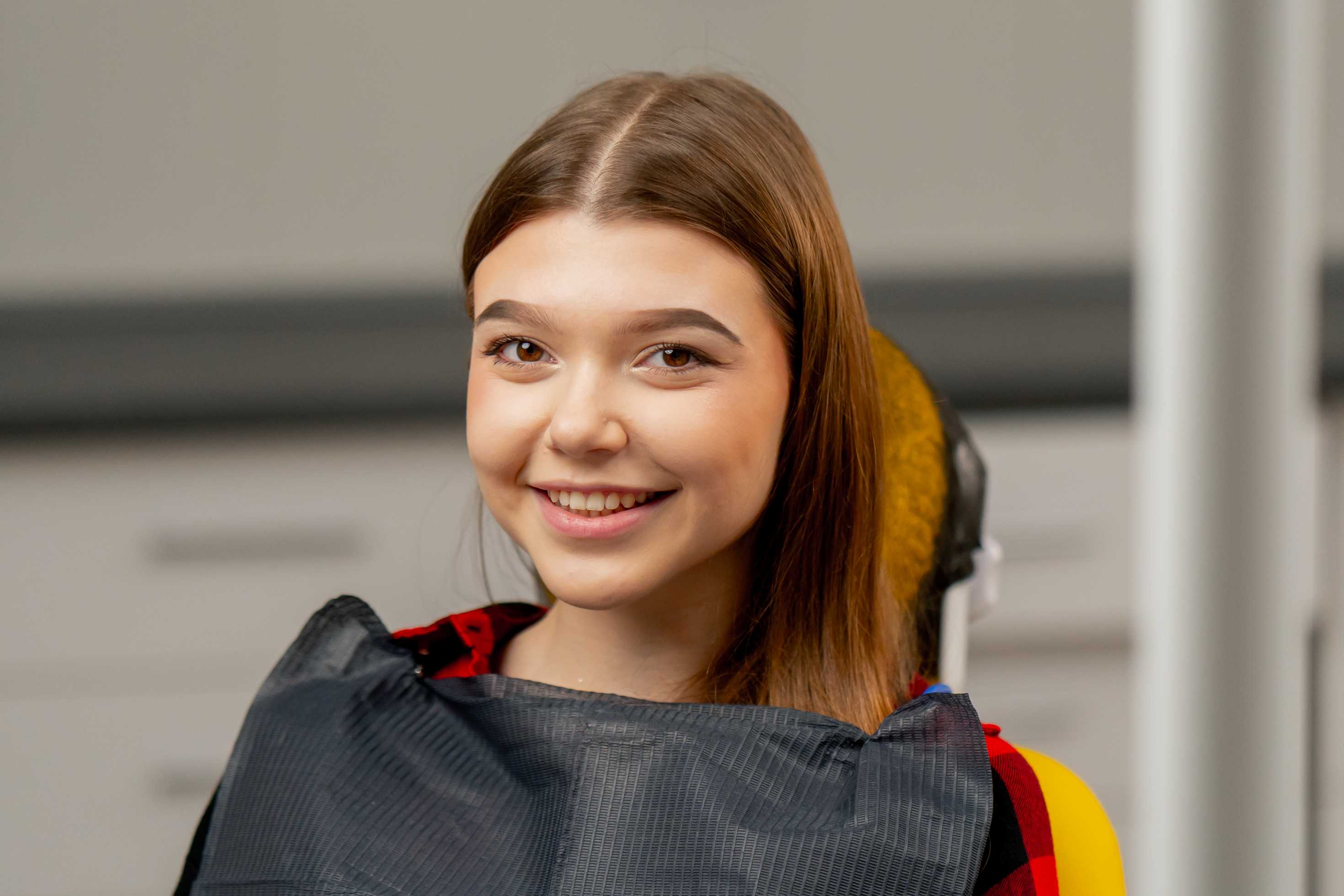 Teen at dental appointment with laughing gas